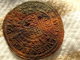 A calculation coin - a regnepenning - from the warship Delmenhorst. A calculation coin is a flat, imitation 'coin' that - together with a calculation board - was used as the simple but effective bid for a calculator at the time. Photo: Morten Johansen / Viking Ship Museum in Roskilde