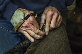 The Viking Ship Museum builds a new reconstruction of a Skuldelev ship. Sail-maker makes all details on the sail by hand.