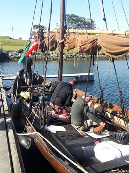 The crew thoroughly examined the charts before the departure from Haugesund. There are many reefs and islands of all sizes on the way south - and many possible ways to travel through the archipelago - which is the best for today's wind? Photo: Torben Okkels. 