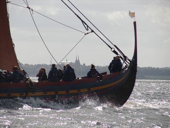 The Sea Stallion on its way to Roskilde with the Cathedral in the background. Photo: Laust M. Ladefoged, København