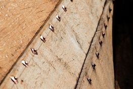 The rivets assemble the planks of the ship along the length of the ship.