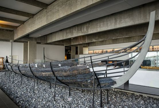 The original Skuldelev 5 ship on display in the Viking Ship Hall at the museum. It was a small long ship in the war fleet, and was build in Denmark around 1030 AD.