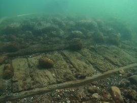 The shipwreck, which marine archaeologists from the Viking Ship Museum are currently investigating, is located on just 3.5 meters of water off the south coast of Lolland. The ship is probably the Danish warship, DELMENHORST, which burned out and sank during the Battle of the Fehmarnbelt in 1644. Photo: Viking Ship Museum in Roskilde