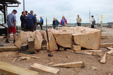 The boatbuilders assess the day's work. Now the long weeks of plank production can begin. 